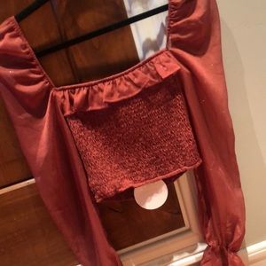 A cropped of the shoulder top and matching skirt